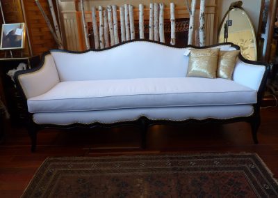 Vintage Traditional Sofa fully reupholstered in white with bright gold nailhead detail and dark mahogany frame.