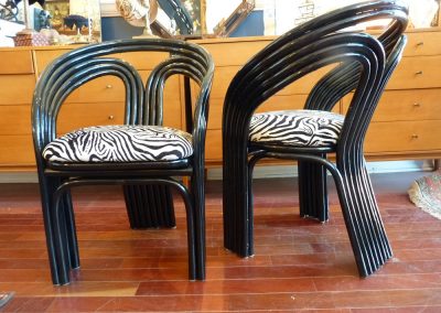 Vintage Bent Rattan Armchairs refinished in High gloss black with newly upholstered seats in zebra print.